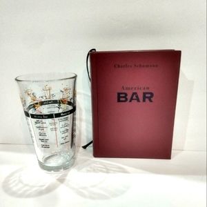 Mixology-Mixed drink recipe book and glass